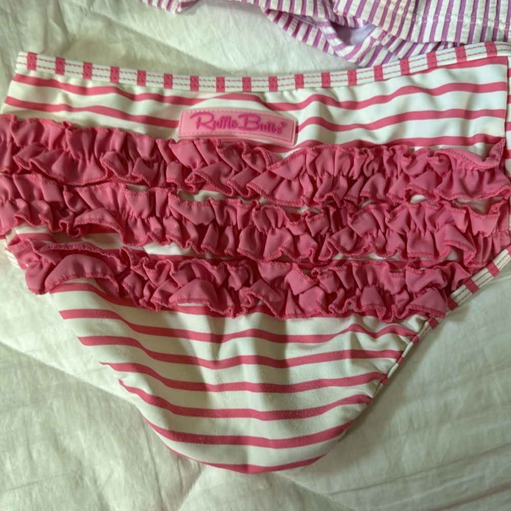 3 bikini bottoms and one bikini and swim shirt. These are all sold as a set - Picture 3 of 5